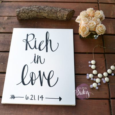 rich in love canvas painting sign